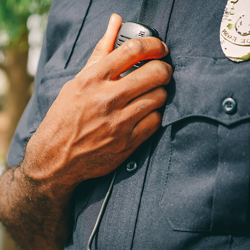 Police officer using on-body wireless set