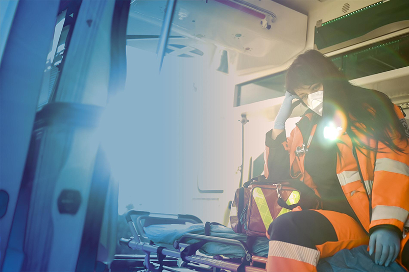 Paramedic inside an ambulance. Paramedic inside an ambulance.